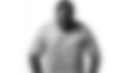 Brandon Graham models one of the shirts that will be auctioned to benefit Frontline Dads and Mothers In Charge.