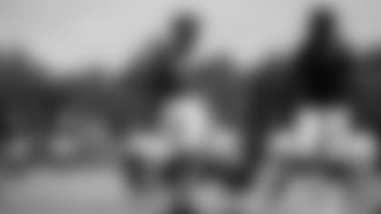 Atlanta Falcons running back Javian Hawkins #25 and Atlanta Falcons running back Caleb Huntley #42 carry veterans’ pads ]during AT&T Atlanta Falcons Training Camp at Atlanta Falcons Headquarters in Flowery Branch, Georgia, on Wednesday August 4, 2021. (Photo by Kara Durrette/Atlanta Falcons)