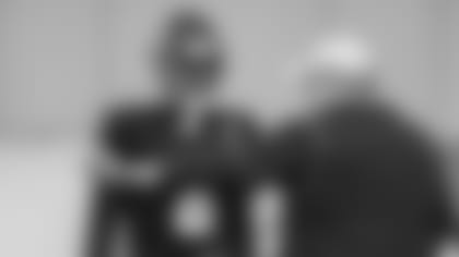 Atlanta Falcons tight end Kyle Pitts #8 talks with Atlanta Falcons head coach Arthur Smith during the AT&T Atlanta Falcons Training Camp at Atlanta Falcons Headquarters in Flowery Branch, Georgia, on Monday August 9, 2021. (Photo by Sam Larsen/Atlanta Falcons)