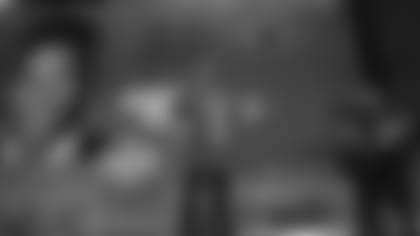 Penn State's Saquon Barkley poses for photos with his New York Giants team jersey during the first round of the NFL football draft, Thursday, April 26, 2018, in Arlington, Texas. (AP Photo/David J. Phillip)