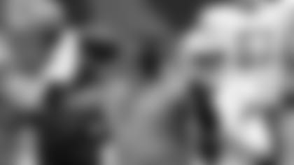 Detroit Lions head coach Darrell Bevell throws during warm ups before an NFL football game against the Chicago Bears in Chicago, Sunday, Dec. 6, 2020. (AP Photo/Charles Rex Arbogast)