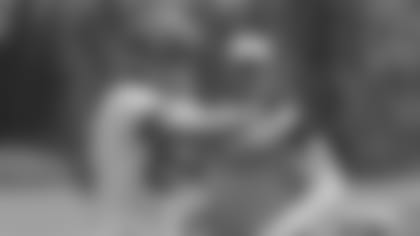 Cincinnati Bengals tight end Tyler Eifert catches a pass in front of offensive coordinator Jay Gruden during the NFL football team's mandatory mini-camp, Wednesday, June 12, 2013, in Cincinnati.  (AP Photo/Al Behrman)