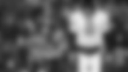 Jacksonville Jaguar quarterback Mark Brunell walks off the field late in the fourth quarter during his teams 20-6 loss to New England Patriots during the AFC Championship game at Foxboro Stadium in Foxboro, Mass., Sunday January 12, 1997. (AP Photo/Winslow Tonson)