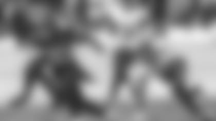 Tennessee Titans safety Kevin Byard (31), right, tears Jacksonville Jaguars running back James Robinson's (30) jersey during the second half of an NFL football game, Sunday, Dec. 13, 2020, in Jacksonville, Fla. Titans won 31-10. (AP Photo/Gary McCullough)