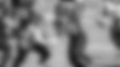 Jacksonville Jaguars wide receiver Laviska Shenault Jr. (10) runs away from the tackle of Jacksonville Jaguars outside linebacker Harold Landry III (58) during the first half of an NFL football game, Sunday, Dec. 13, 2020, in Jacksonville, Fla. (AP Photo/Stephen B. Morton)