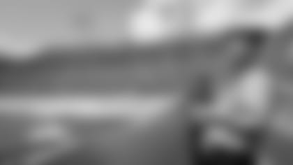 A member of the military holds a giant American flag on the field prior to an NFL football game between the Jacksonville Jaguars and the Green Bay Packers at EverBank Field, Sunday, Sept. 11, 2016 in Jacksonville, Fla. The Packers defeated the Jaguars 27-23. (Perry Knotts via AP)