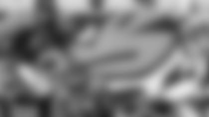 Jacksonville Jaguars' Daryl Smith, center, waits on the ball to make a fourth-quarter interception against the Indianapolis Colts, Sunday, Oct. 3, 2004, in Jacksonville, Fla.  Jacksonville's Akin Ayodel, left, and Indianapolis' Dallas Clark, right, watch the play. (AP Photo/Phil Coale)