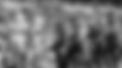 Jacksonville Jaguars running back James Robinson (25), center, stands in the end zone after scoring a touchdown during the second half of an NFL football game between the Miami Dolphins and the Jacksonville Jaguars at the Tottenham Hotspur stadium in London, England, Sunday, Oct. 17, 2021. (AP Photo/Ian Walton)