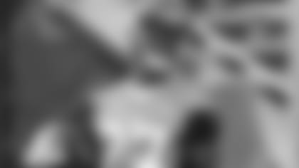 Jacksonville Jaguars running back Leonard Fournette smiles after a run with the ball during an NFL football practice Tuesday, June 12, 2018, in Jacksonville, Fla. (AP Photo/John Raoux)