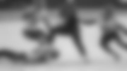 Jacksonville Jaguars running back James Robinson (30) is tackled by Tennessee Titans safety Kevin Byard (31), cornerback Malcolm Butler (21) and linebacker Rashaan Evans (54) after catching a short pass during the second half of an NFL football game, Sunday, Dec. 13, 2020, in Jacksonville, Fla. (AP Photo/Phelan M. Ebenhack)