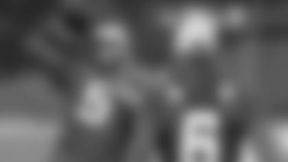 Jacksonville Jaguars quarterback Blake Bortles, left, throws the football to Jacksonville Jaguars quarterback Cody Kessler during a training session at Allianz Park in London, Friday Oct. 26, 2018. The Jacksonville Jaguars are preparing for an NFL football game against the Philadelphia Eagles at London's Wembley stadium on Sunday. (AP Photo/Tim Ireland)