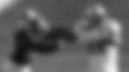 American Team running back Taiwan Deal (21) stiff-arms National Team linebacker Quincy Williams during the first half of the NFLPA Collegiate Bowl football game Saturday, Jan. 19, 2019, in Pasadena, Calif. (AP Photo/Marcio Jose Sanchez)