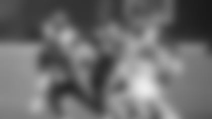 Jacksonville Jaguars running back James Robinson (30) tries to outrun the Cleveland Browns defense during the first half of an NFL football game, Sunday, Nov. 29, 2020, in Jacksonville, Fla. (AP Photo/Stephen B. Morton)