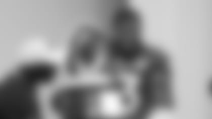 AFC defensive end Calais Campbell, of the Jacksonville Jaguars, (93) holds the Pro Bowl trophy after the NFL Pro Bowl football game, Sunday, Jan. 26, 2020, in Orlando, Fla. The AFC defeated the NFC 38-33. Campbell won the MVP defensive player of the game. (AP Photo/Chris O'Meara)