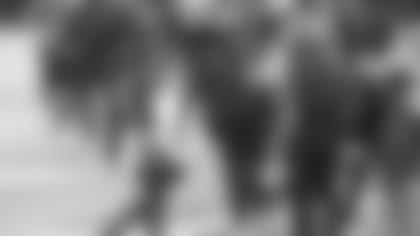 Jacksonville Jaguars quarterback Gardner Minshew II, left, talks with offensive coordinator Jay Gruden after a series during the second half of an NFL football game against the Tennessee Titans, Sunday, Dec. 13, 2020, in Jacksonville, Fla. (AP Photo/Phelan M. Ebenhack)