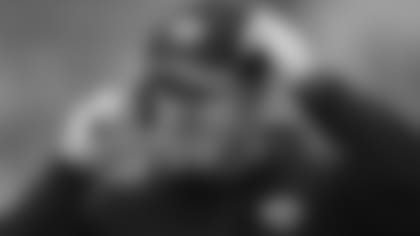 Jacksonville Jaguars defensive line coach Todd Wash adjusts his headset during the first half of an NFL football game against the Baltimore Ravens in Baltimore, Sunday, Dec. 14, 2014. (AP Photo/Gail Burton)