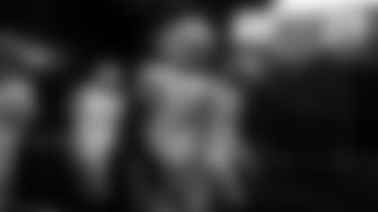 QBs Aaron Rodgers and Jordan Love lead the team out of the tunnel