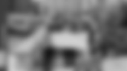 Packers Foundation chairperson Tom Cardella presents $125,000 check to All-In Milwaukee