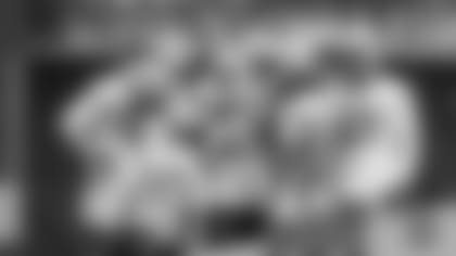 WR Davante Adams huddles with wide receivers