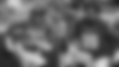 RB Corey Grant and DL Olive Sagapolu