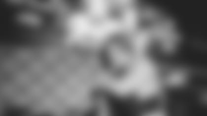 Thomas Davis hugs Greg Olsen