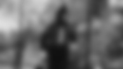 Cam Newton running to practice