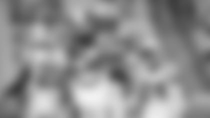 Cam Newton hugs Donte Jackson