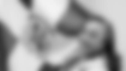 Dr Subero headshot w flag