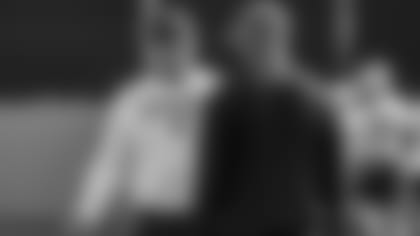 Ron Rivera and Eric Washington at practice