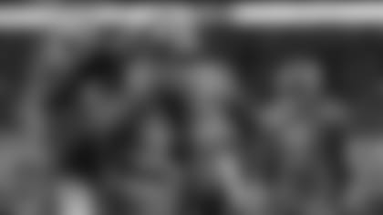 Clemson offensive lineman Sean Pollard (76) congratulates wide receiver Tee Higgins (5) following Higgins' touchdown against Virginia during the first half of the Atlantic Coast Conference championship NCAA college football game in Charlotte, N.C., Saturday, Dec. 7, 2019. (AP Photo/Gerry Broome)