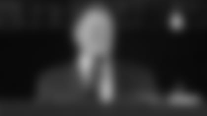 bill-belichick-smile-podium-suit-wm-adler