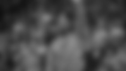 New England Patriots running back James White and former Wisconsin football player acknowledges the crowd during the first half of an NCAA college basketball game between Wisconsin and Maryland, Sunday, Feb. 19, 2017, in Madison, Wis. (AP Photo/Andy Manis)