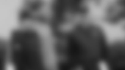 Nick Bosa, center, talks with Oakland Raiders coach Jon Gruden, left, and general manager Mike Mayock during an NFL local pro day at the team's football facility in Alameda, Calif., Thursday, April 11, 2019.