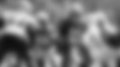 Patriots quarterback Mac Jones (10) drops back to pass during a joint practice with the Carolina Panthers.