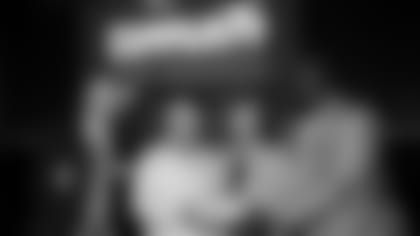 Procter & Gamble’s VP of Grooming, North America, John Claughton (far left), Patriots Chairman and CEO Robert Kraft and Patriots and Pro Football Hall of Famer Andre Tippett congratulate Thelma Burns from the Grimes King Foundation for the Elderly for being selected as the 2022 Myra Kraft Community MVP Award grand prize winner. During the June 8 luncheon, the Kraft family, the Patriots Foundation and Gillette awarded $275,000 in grants to 26 New England nonprofits. The Grimes King Foundation for the Elderly received a $25,000 grant in honor of Thelma’s volunteer efforts.