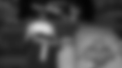 Oregon defensive back Christian Gonzalez stands on stage after being chosen by the New England Patriots with the 17th overall pick during the first round of the NFL football draft, Thursday, April 27, 2023, in Kansas City, Mo.