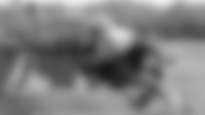 Patriots offensive lineman work through a blocking drill.