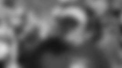 Allison and Amanda pose with the University of New Hampshire mascot at Domino's Grand Re-Opening in Durham, NH.