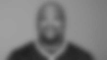 Pat Patriot poses with fans at a surprise party in Medfield, MA.