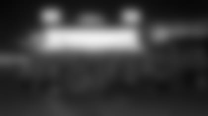 The New England Patriots Charitable Foundation's team of runners for the Boston Marathon posed for a picture at a pasta dinner on April 12. Photo by Dan MacPherson