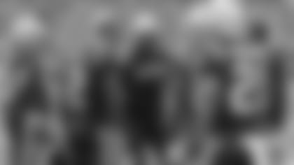 Devin McCourty leads the defensive huddle.