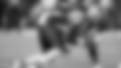 New England Patriots defensive end Michael Buchanan (99) gets set for the snap during the NFL week 4 regular season football game against the Kansas City Chiefs on Monday, September 29, 2014 in Kansas City, Mo. The Chiefs won the game 41-14. (AP Photo/Paul Spinelli)