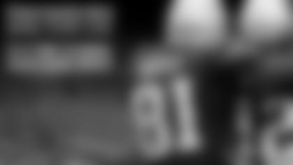 Malcolm answers questions from students in the cafeteria. Photo by Dan MacPherson