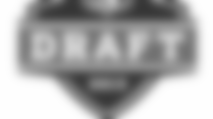 New England Patriots quarterback Tom Brady (12) scrambles away from Tennessee Titans' Mike Martin (93) and Karl Klug (97) in the fourth quarter of an NFL football game, Sunday, Sept. 9, 2012, in Nashville, Tenn. The Patriots won 34-13. (AP Photo/Joe Howell)