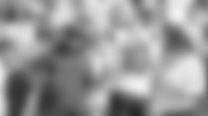 Patriots head coach Bill Belichick talks with quarterback Mac Jones (10).