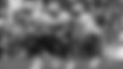 Patriots offensive lineman David Andrews (60), Cole Strange (50) and more line up for a drill at Training Camp.