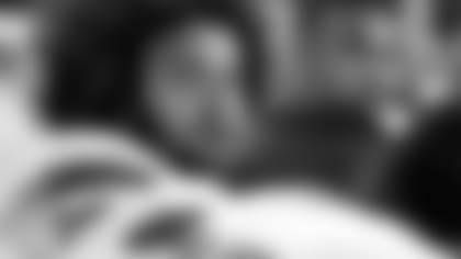 Jamie Collins talks with the media.