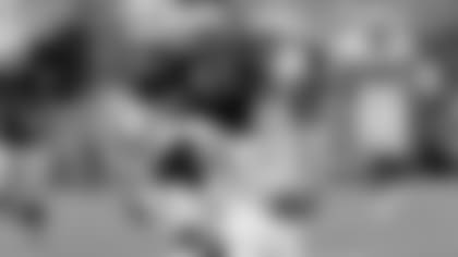 FB Marcel Reece hurdles the defender for another first down.