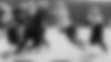 Raiders defensive end Arden Key (99) and tackle Kolton Miller (74) on the field for practice.