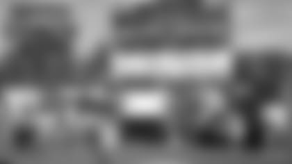 Pinole Valley High School's football coach, Luke Bodwin is awarded with the Tom Flores High School Coach of the Week by Raiders alumni, Charlie Smith, and the Raiderettes at Pinole Valley High School, Wednesday, September 26, 2018, in Pinole, California.